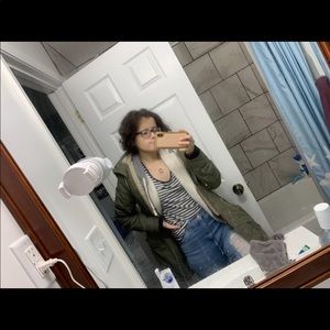 Showing black and white striped shirt I’m selling